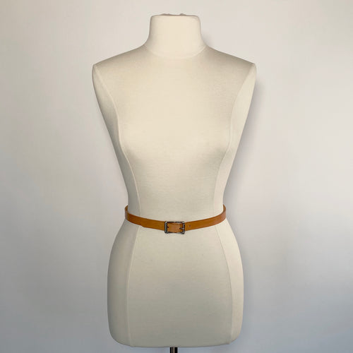 A mannequin with a slim, feminine brown leather belt and elegant stainless steel buckle.